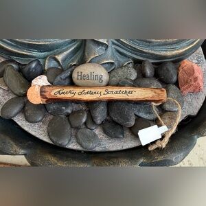 Handmade wooden lucky lottery scratcher with penny attached.